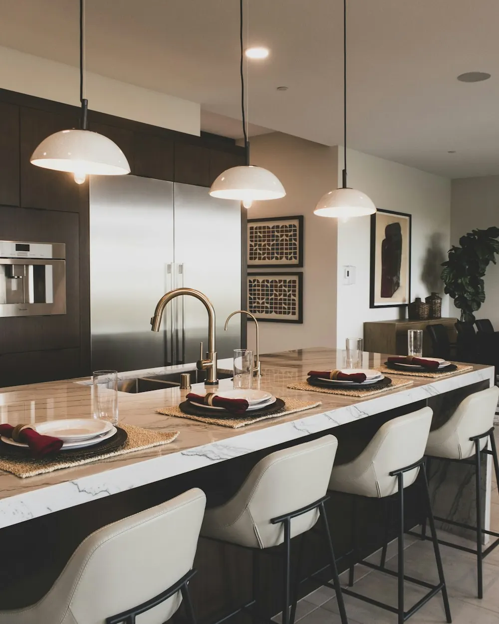 Dark wood modern kitchen with a stone island and pendant lights