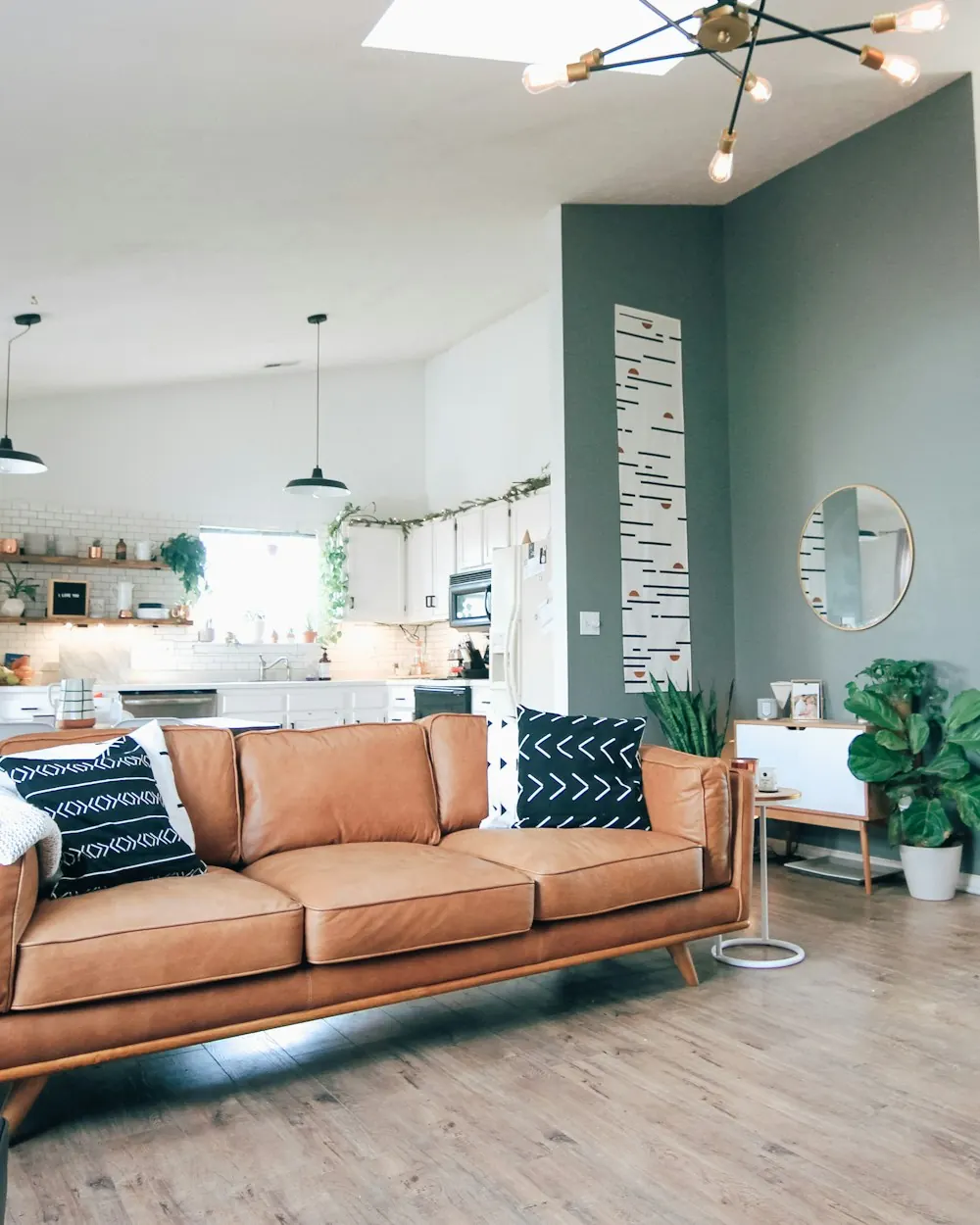 Freshly painted living room with a teal-green accent wall