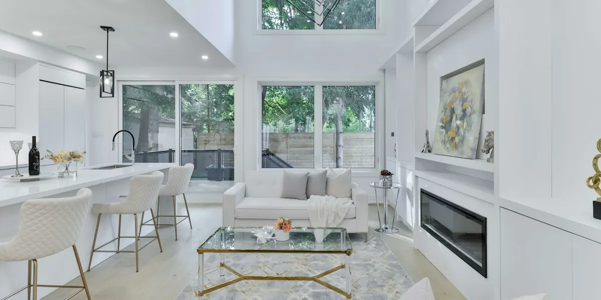 Bright open-plan kitchen and living area with double-height ceilings